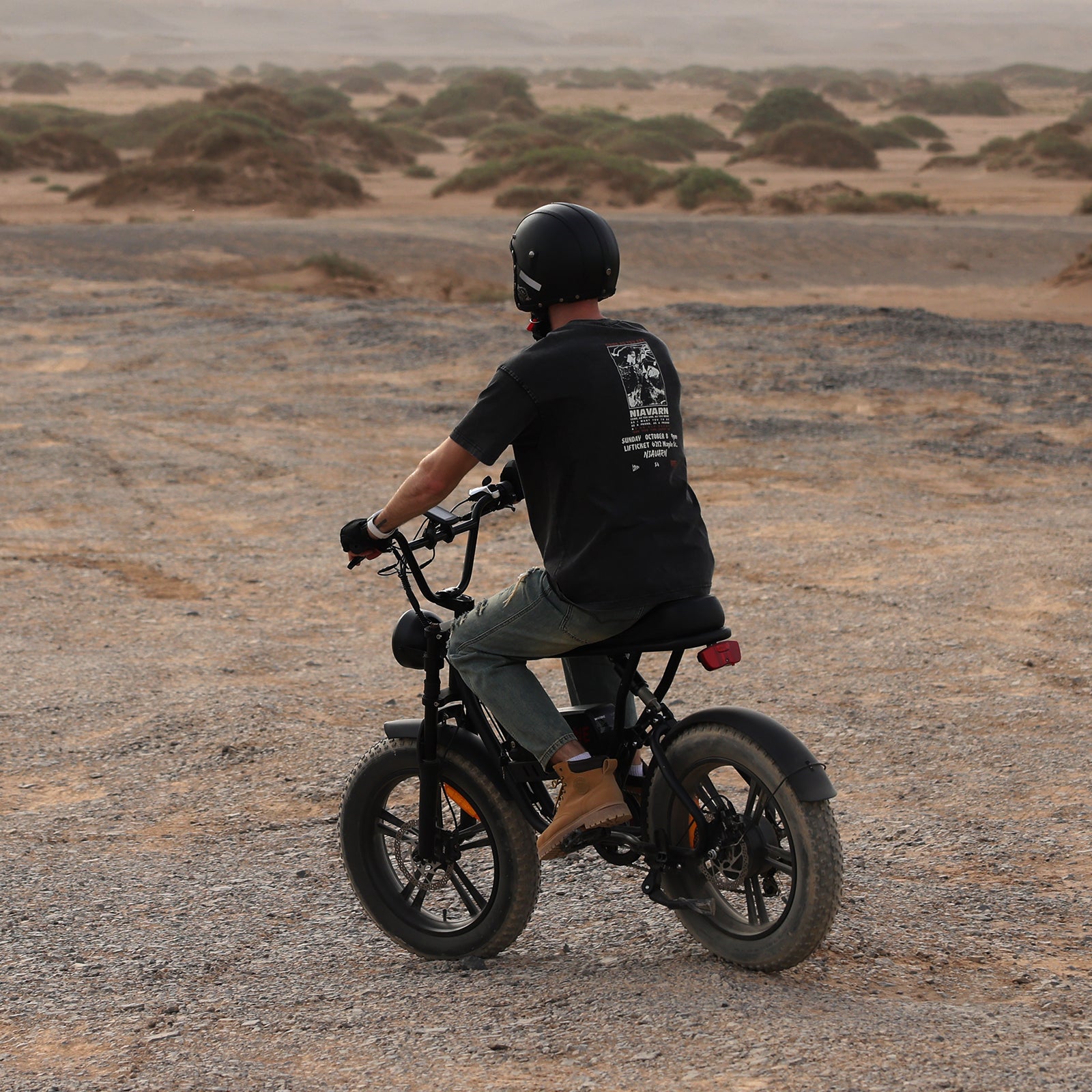 A man riding a Windone K2 Fat Tire Electric Bike in the Gobi Desert